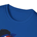Close-up of a blue t-shirt with a design of a person wearing a headscarf.