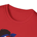 Close-up of a red shirt with a design of a person with an afro wearing a headscarf.