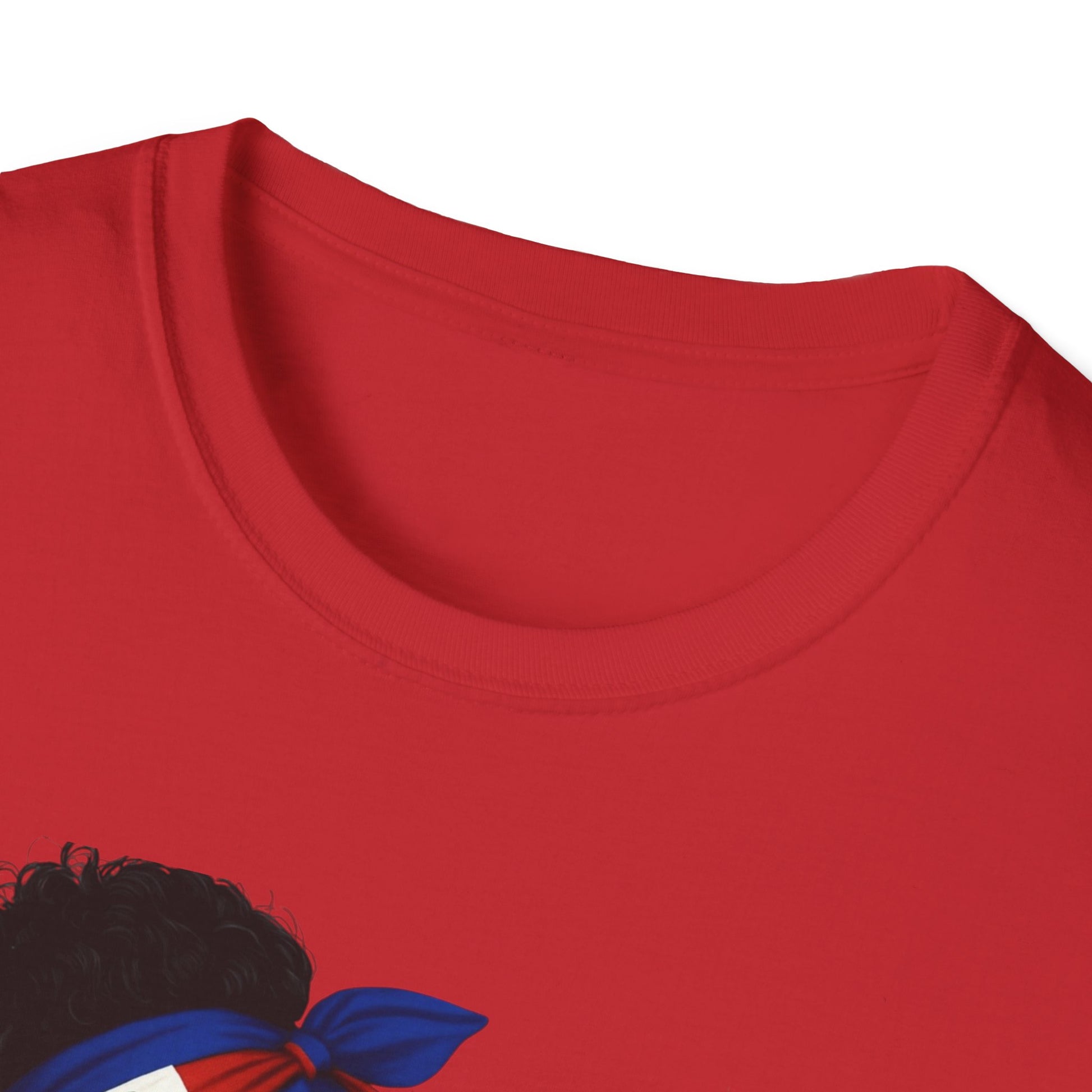 Close-up of a red shirt with a design of a person with an afro wearing a headscarf.