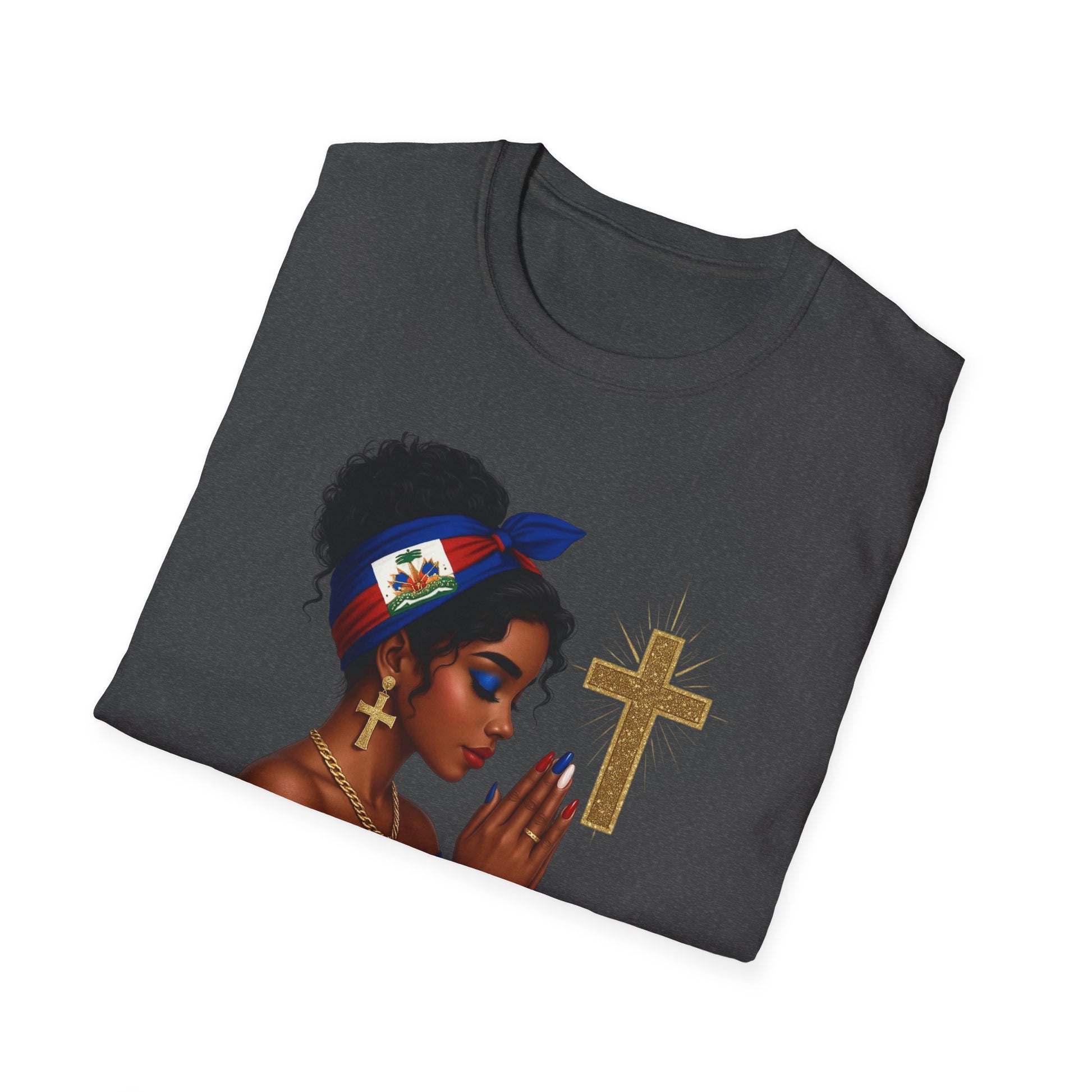 Folded black t-shirt with a graphic of a woman, cross, and flag on a white background