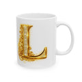 White mug with a gold decorative letter 'L' on a white background