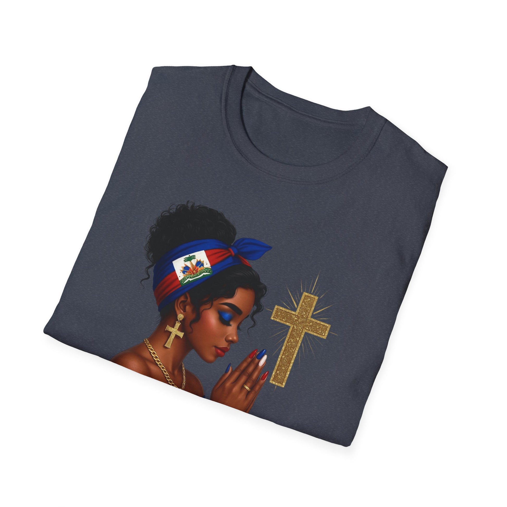 Folded t-shirt with a graphic of a woman holding a cross on a white background