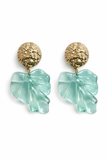 Pair of earrings with gold tops and light blue leaf-shaped drops on a white background