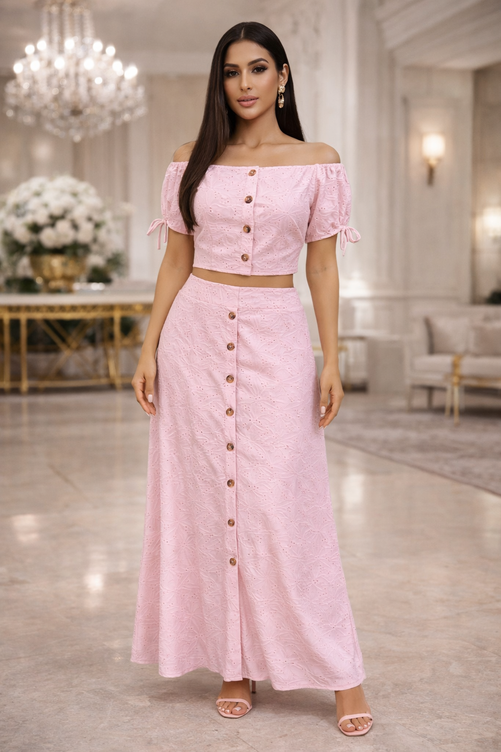 Woman wearing a pink outfit with buttons in an elegant indoor setting
