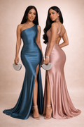 Two women in elegant evening gowns on a beige background
