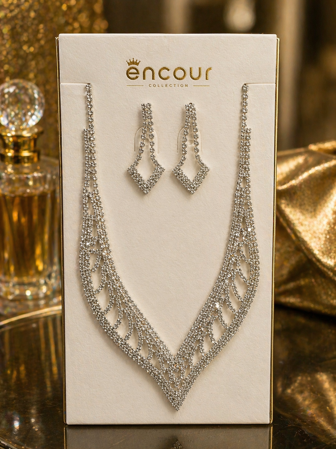 Necklace and earrings set on a 'encour' branded display card.