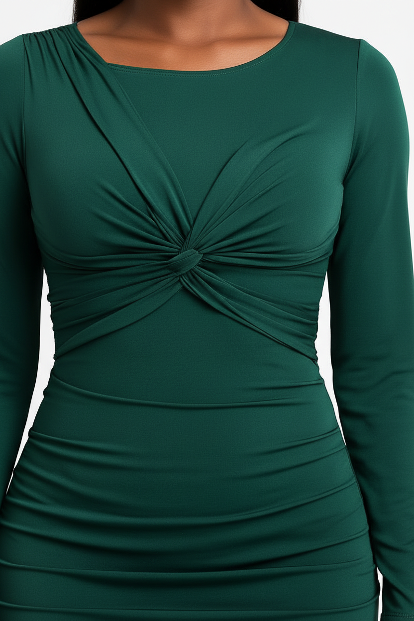 A close-up of a dark green long-sleeve dress with a twisted knot detail at the center of the chest and horizontal ruching at the waist.
