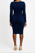 Navy blue long-sleeve dress worn by a model on a white background