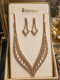 Necklace and earrings set on a 'encour' branded display card.