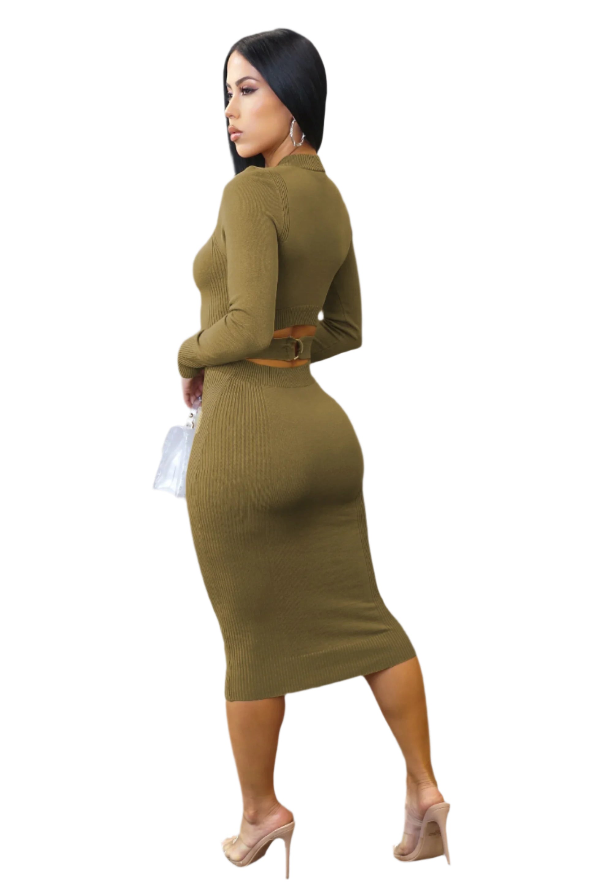 Woman wearing a green ribbed dress on a white background