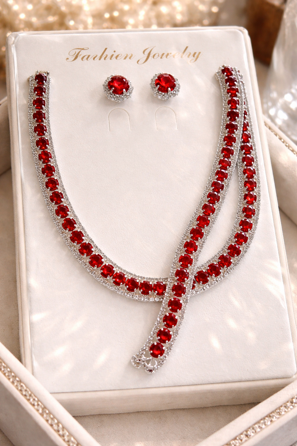 Silver necklace and earrings set on a 'Fashion Jewelry' card.