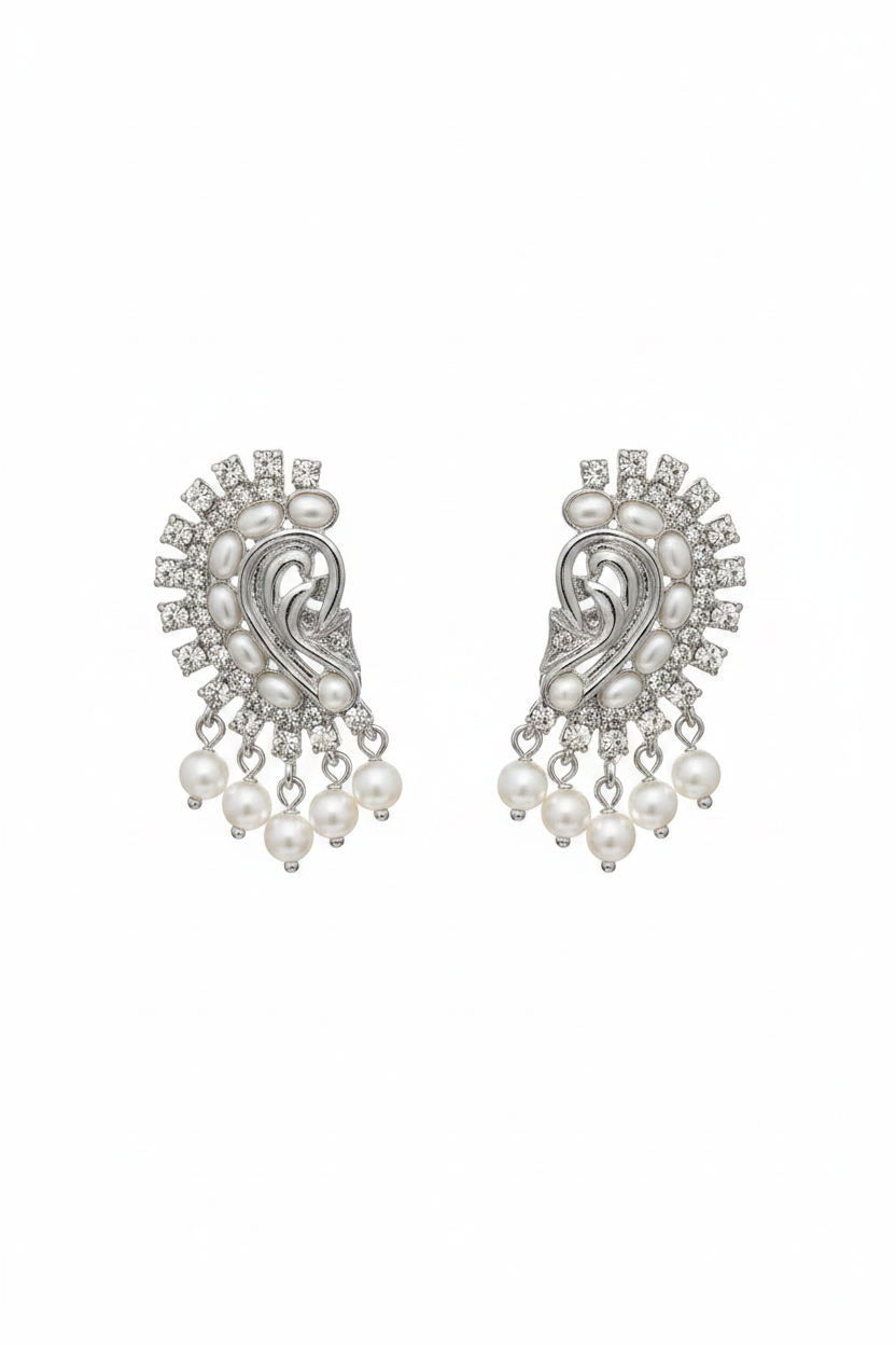 A pair of silver-tone paisley dangle earrings adorned with white faux pearls and clear rhinestones, set against a plain white background.