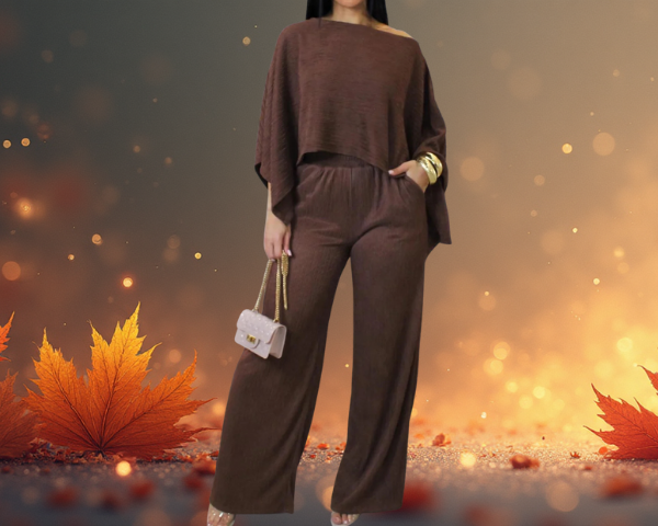 Person wearing a brown outfit with autumn leaves in the foreground